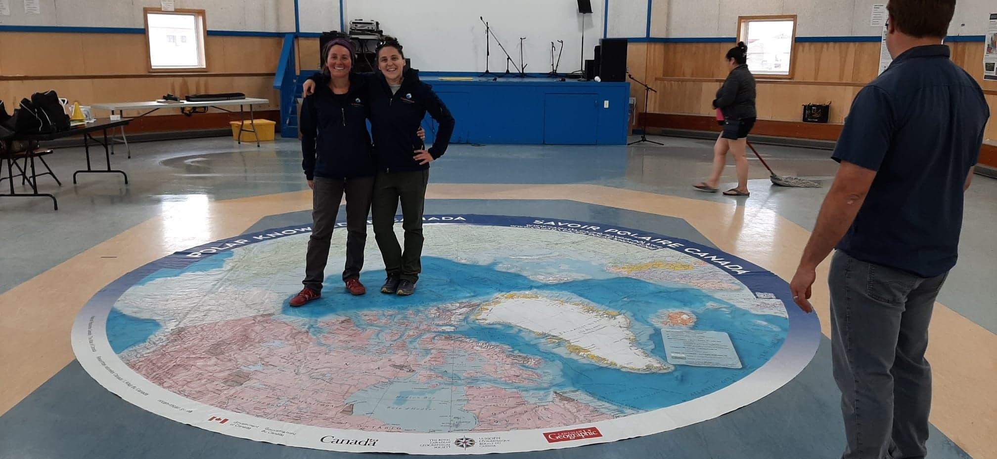 Gwénaëlle Chaillou, Université du Québec à Rimouski, and Joannie Ferland on the Arctic Ocean map during the Tuktoyaktuk Science Day, August 1, 2019. ©Joannie Ferland Takuvik2019 Picture10 5