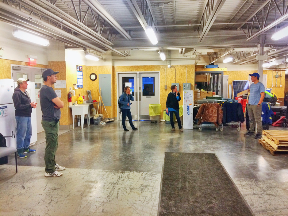 At the Western Arctic Research Center of the Aurora Research Institute, the ULAVAL/ISMER team visits the facility including laboratories and loading bay (seen here), in Inuvik, Northwest Territories, Canada, February 22, 2019. On this photo: Joel McAlister (left), Greg Elias, Marie-Hélène Forget, Gwénaëlle Chaillou and Edwin Amos (right). ©Martine Lizotte Takuvik2019 Picture2 2
