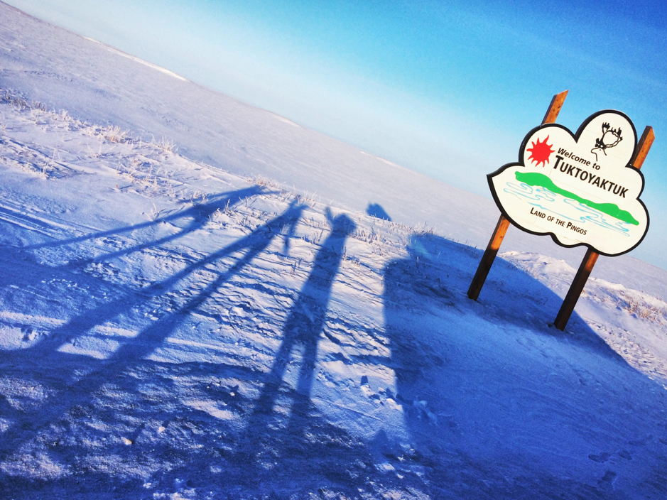 Marie-Hélène Forget, Gwénaëlle Chaillou and Martine Lizotte take a moment at the entrance of the Hamlet of Tuktoyaktuk to admire the scenery, Tuktoyaktuk, Northwest Territories, Canada, February 21, 2019. ©Martine Lizotte Takuvik2019 Picture2 3