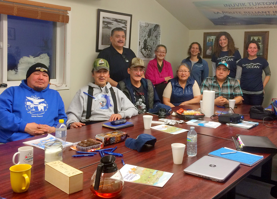 The ULAVAL/ISMER team meets with the Tuktoyaktuk Hunters and Trappers Committee in Tuktoyaktuk, Northwest Territories, Canada, February 20, 2019. On this photo: front row (sitting) from left to right, Richard Gruben, Jim Elias, Christopher Felix, Eileen Jacobson, Richard Cockney ; and back row (standing) from left to right, Darrel Nasogaluak, Evelyn Cockney, Marie-Hélène Forget, Martine Lizotte, Gwénaëlle Chaillou. ©Glenna Emaghok Takuvik2019 Picture2 7