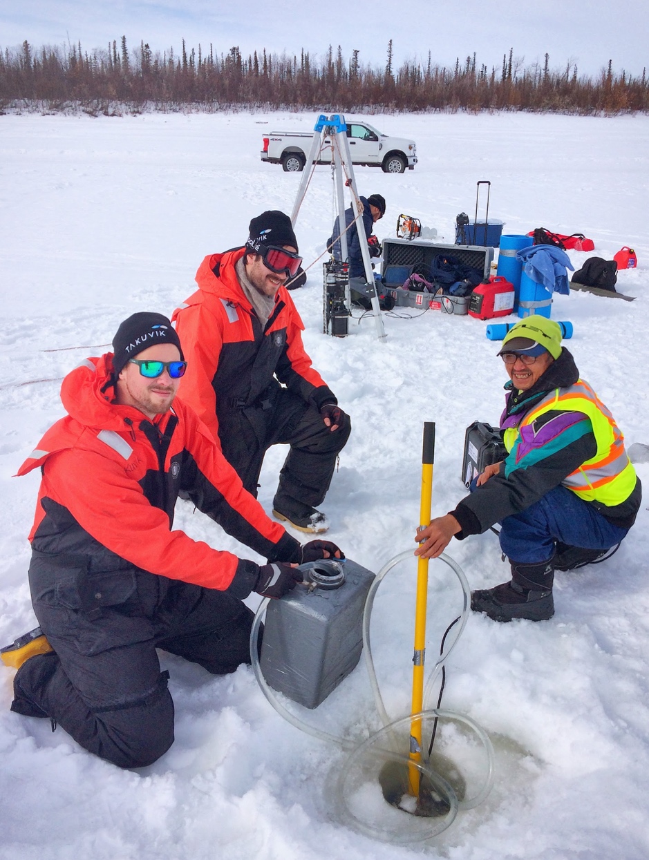 Bennet Juhls, Thomas Bossé-Demers and Miles Dillon collecting water. Laurent Oziel in the back deploying optical instruments, April 20, 2019, Inuvik, Northwest Territories. ©Martine Lizotte. Takuvik2019 Picture4 5 web
