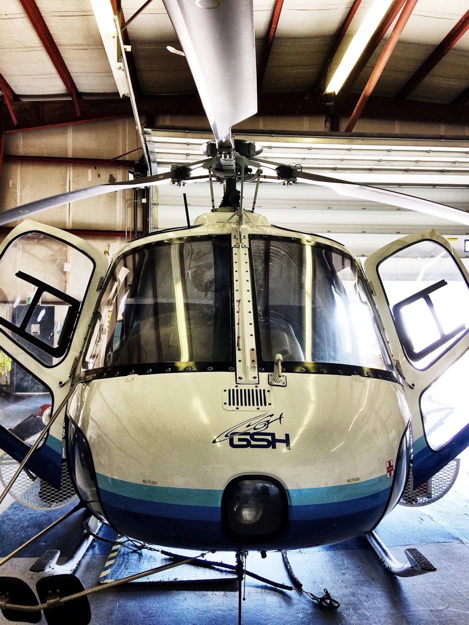 The team visits with Connor Gould, assistant base manager in Inuvik and pilot for Great Slave Helicopters (GSH) who shows us the AStar that will take us to the Western sector of the Mackenzie Delta, April 21, 2019, Inuvik, Northwest Territories. ©Martine Lizotte. Takuvik2019 Picture4 9 web