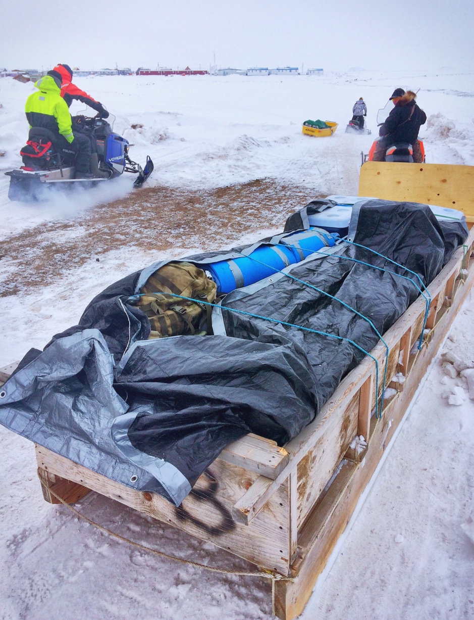 The Eastern Sector team ride their snowmobiles pulling sleds fully loaded with optical instruments and ice-water-sediment sampling equipment, in Tuktoyaktuk, Northwest Territories, April 27, 2019. ©Martine Lizotte. Takuvik2019 Picture5 13 web