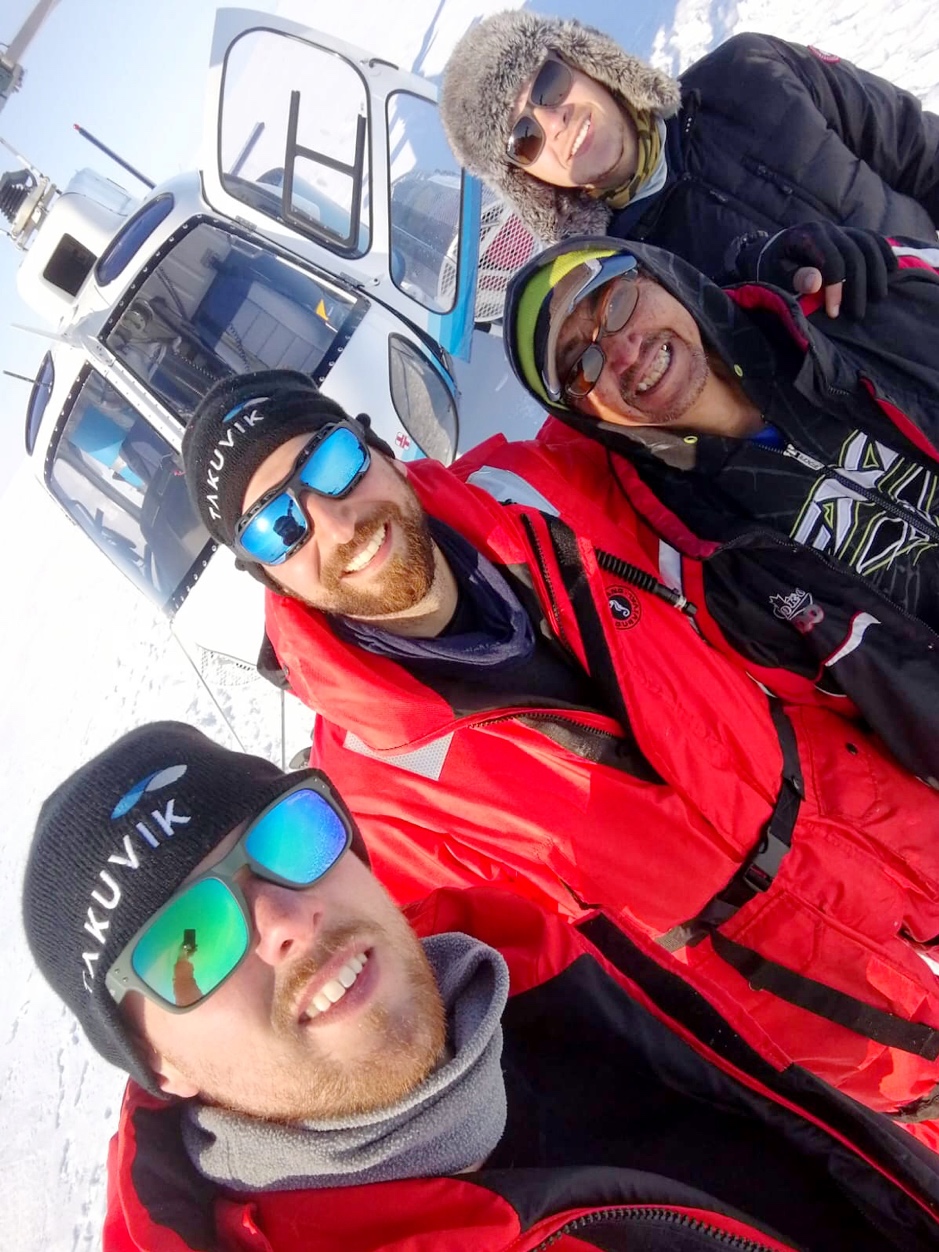 Bennet Juhls (front), Laurent Oziel, Miles Dillon (IHTC wildlife monitor and field worker) and Connor Gould (GSH pilot) pose in front of the AStar helicopter, Western Sector of the Mackenzie Delta, Northwest Territories, April 25, 2019. ©Bennet Juhls. Takuvik2019 Picture5 2 web