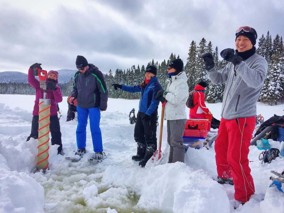 Marie-Hélène Forget (left) prepares to use the ice coring device, Piché Lake, Forêt Montmorency, Canada, February 4, 2019. Also in this picture Christian Katlein, Joannie Ferland, Caroline Guilmette, Béatrice Saint-Cricq and Atsushi Matsuoka. ©Martine Lizotte. Takuvik spring prep 2019 M.Lizotte Picture6