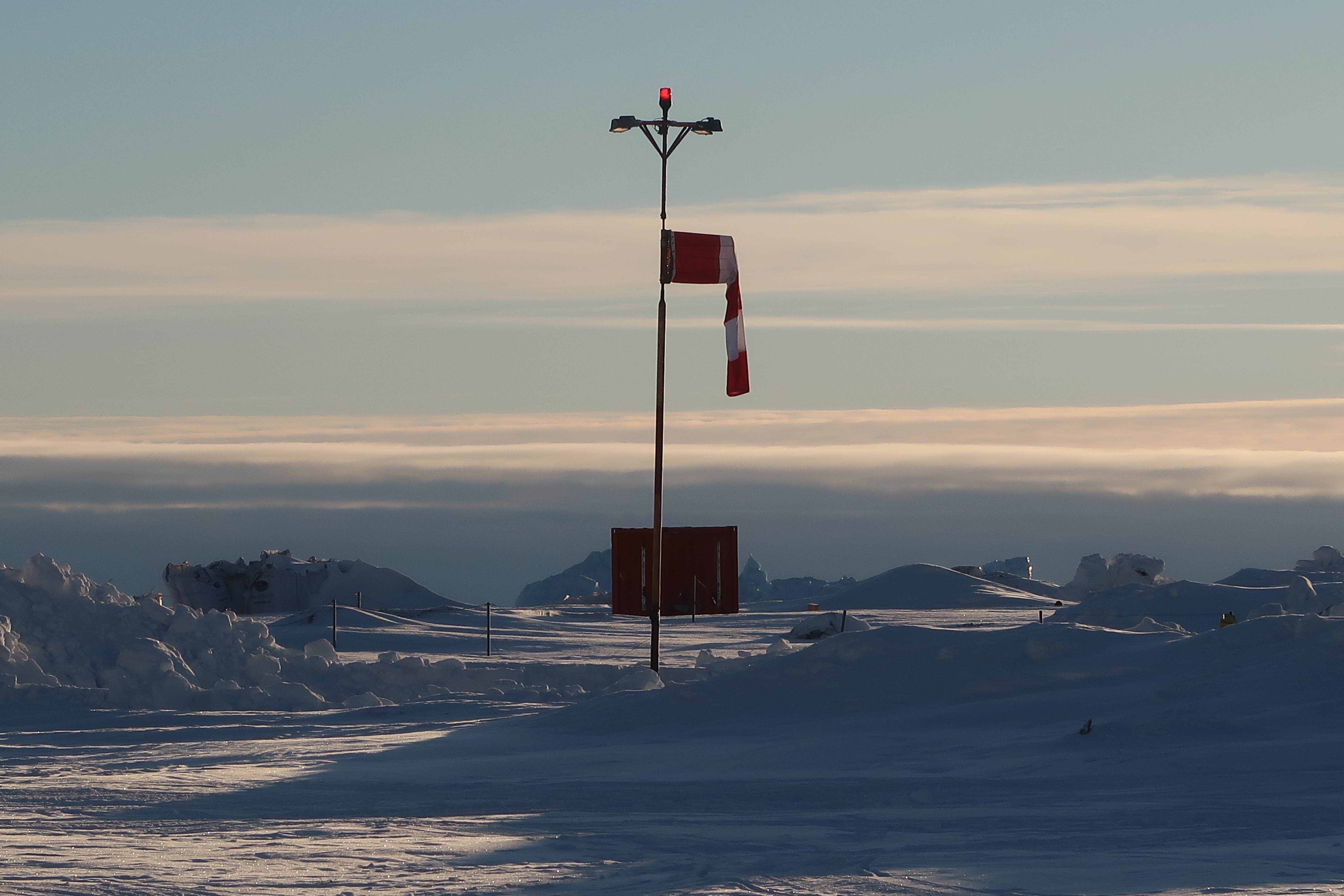 The heliport in Qeqertarsuaq. ©Joan Nymand Larsen Ilulissat spring 2019 Joan Nymand Larsen Heliport flag web
